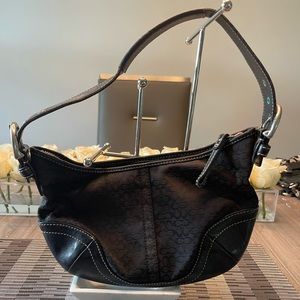 Small black Coach signature shoulder bag.